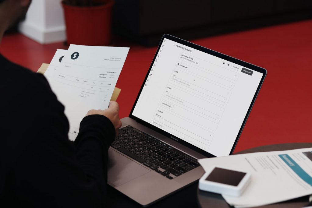 Invoice finance agreement with business documents and calculator on desk